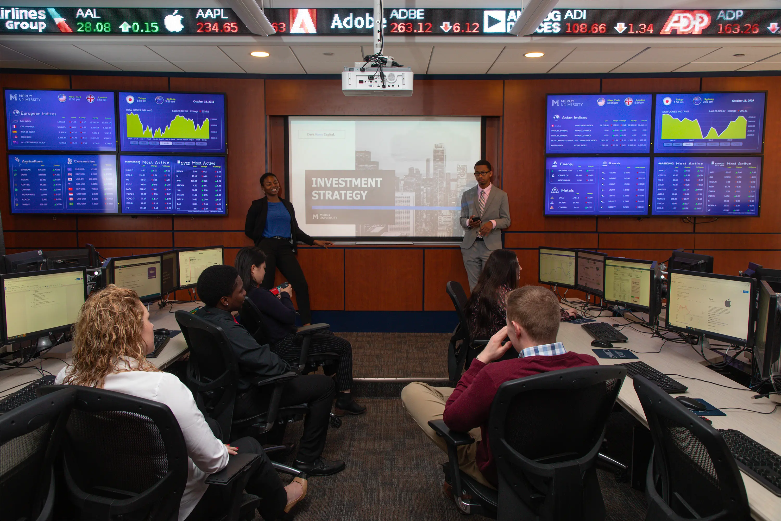 Business students working in the trading room