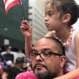 Dr. Matías-Ortiz and unmoved daughter at Puerto Rican parade