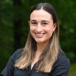 headshot of Rachel who is a white woman with brown hair