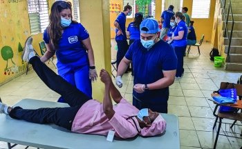 Photo of students with patient