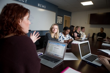 Students with computers in liberal arts class