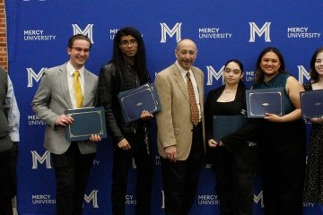 Mercy University students pose with their awards and Media Studies professor Louis Grassoat the 40th Annual Quill Awards