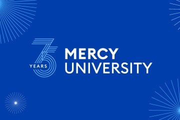 Mercy University  and 75th anniversary logo with fireworks in background