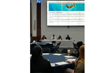 Panelists and audience at Mercy and WCA's World Health Day event