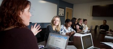 Students with computers in liberal arts class
