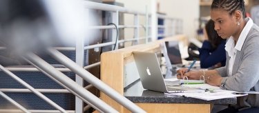 Woman working on her degree.