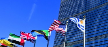 International flags in front of United Nations building.