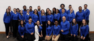 Teams of counselors in blue shirts