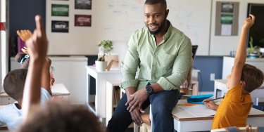 school teacher in classroom with students