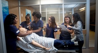 Mercy University Nursing students practice their skills in a simulation lab
