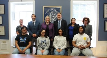 Mercy University and Cristo Rey Network officials along with students