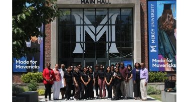 High school students from the White Plains Youth Bureau in front of Mercy University Main Hall
