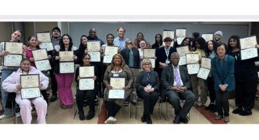 Mercy University mediation training program participants holding up their certificates