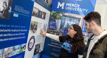 Mercy University students checking out the 75th Anniversary Exhibit