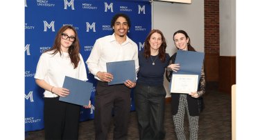 Mercy University student and faculty at 42nd Annual Quill Awards