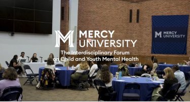 Attendees at Mercy University's Rotunda for the The Interdisciplinary Forum on Child and Youth Mental Health 
