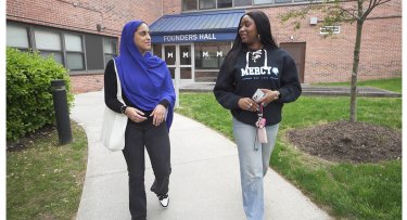 Mercy University students walking from Founders Hall in the Westchester Campus