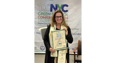 Dr. Meghan Marrero holding Beacon of Blue Award