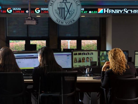 Students learning in the Mercy trading room