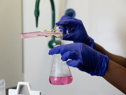 closeup of student holding erlenmeyer flask