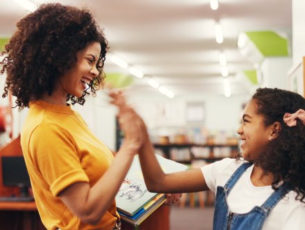 teacher and student high five