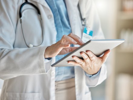 health care worker with tablet