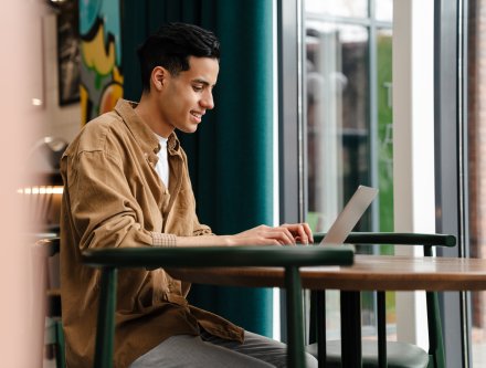 math student working on a laptop