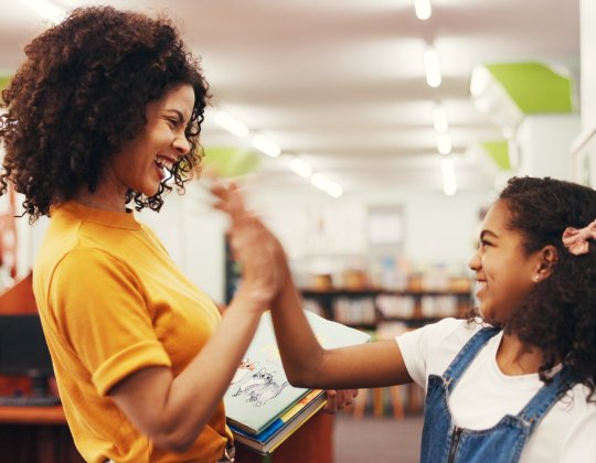 teacher and student high five