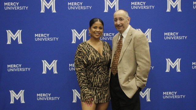 Professor Louis Grasso poses with alumna and Quill Awards honoree Kai Bailer