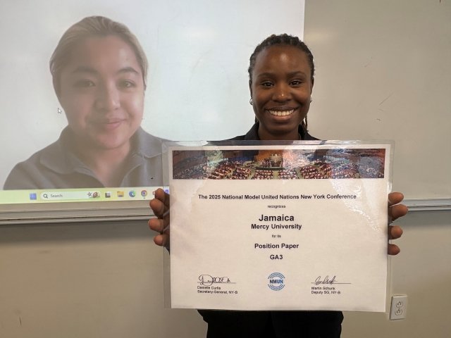 Model UN team members pose with their Outstanding Position Paper award