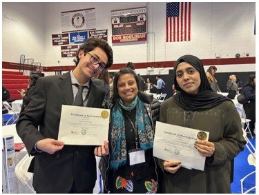 Students winners pose with their faculty mentor at MACUB conference