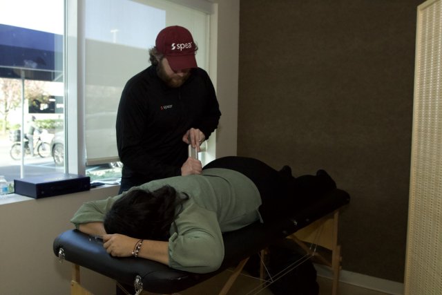 Attendee received physical therapy service during Day of Wellness hosted by the School of Nursing